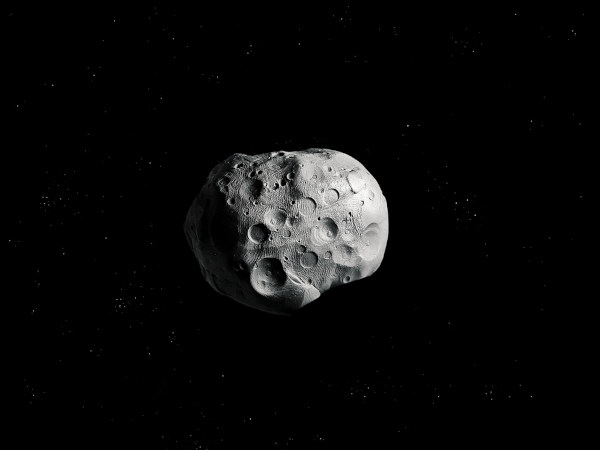 Asteroide com crateras no espaço.