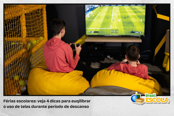 Foto de crianças jogando videogame.